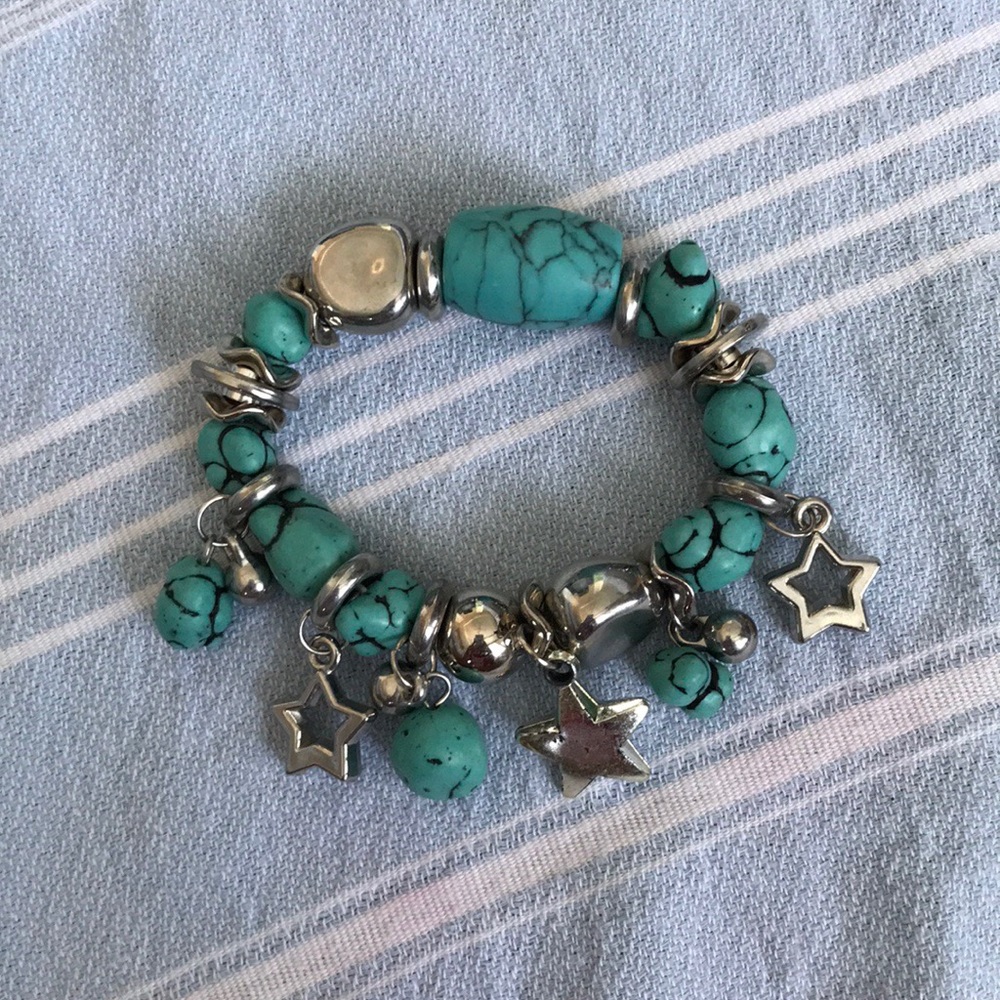 Thick bracelet with star/rock charms